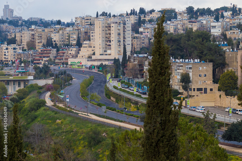 jerusalem-israel. 10-04-2020.  The road on Herzog Street in Jerusalem and its commercial center, against the background of the buildings of the Katamon neighborhood photo