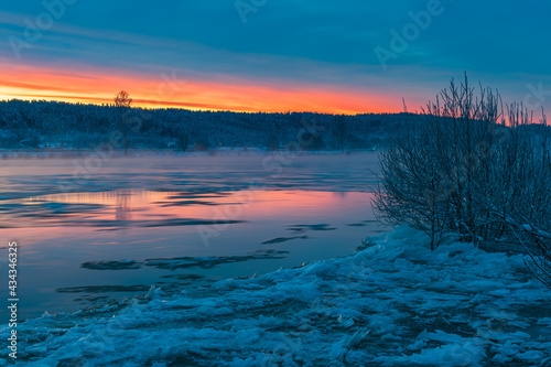 Sunrise at icy river  Sweden