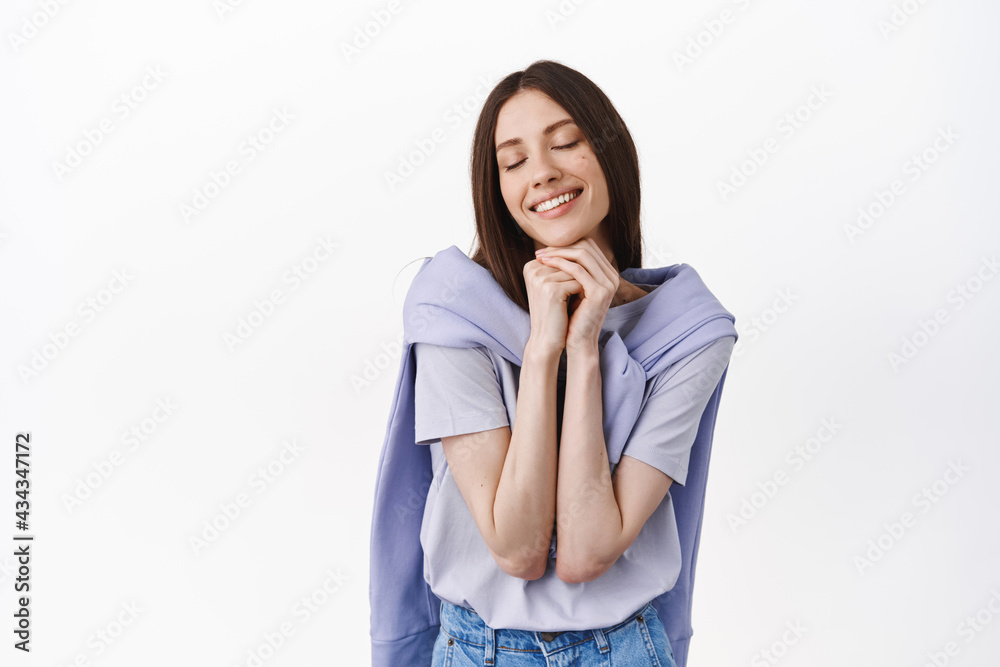 Dreamy caucasian woman daydreaming, close eyes and thinking about something beautiful, feel nostalgic, remember beautiful memories, standing over white background Dreamy caucasian woman daydreaming, close eyes and thinking about something beautiful, feel nostalgic, remember beautiful memories, standing over white background