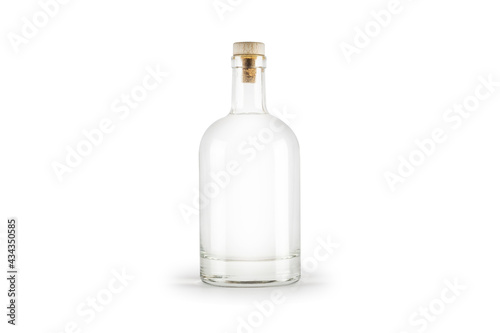 Transparent bottle with alcohol liquid isolated on white background.