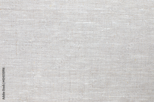 texture of natural linen fabric of gray color close-up. background for your mockup