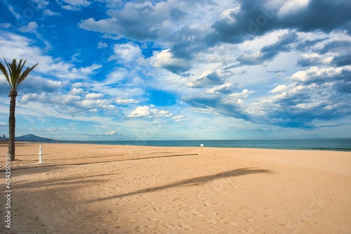 Blue sky with broken clouds in spring on the seashore