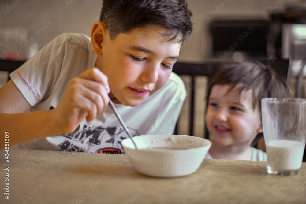 the older brother feeds the younger one porridge the older brother feeds the younger one porridge