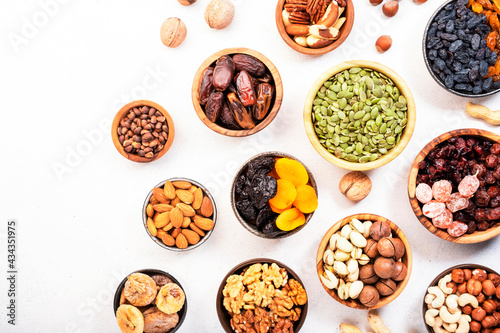 Nuts and dried fruits. Dried apricots, figs, raisins, pecans, walnuts, hazelnuts, almonds and other. White background, top view