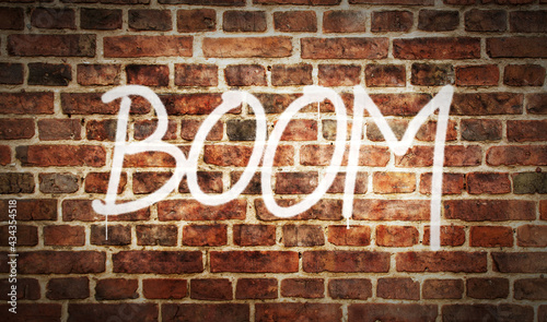 Boom spray painted inscription on the brick wall