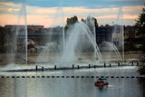 Evening view to Musical fountain with laser animations Roshen on the Southern Buh river in Vinnytsia, Ukraine. May 2021
