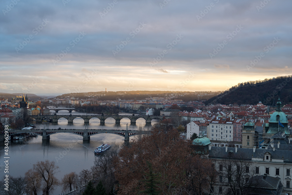 View of the bridge at sunset in Prague from the park