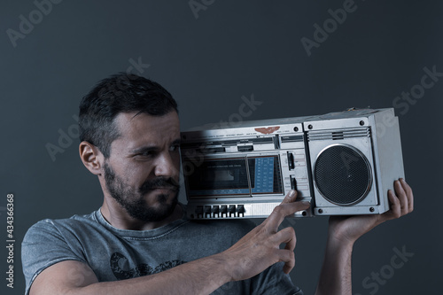  adult man posing with a loudspeaker