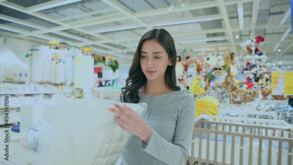 Shopping concept of 4k Resolution. Asian women choosing bedding in the mall. Shopping concept of 4k Resolution. Asian women choosing bedding in the mall.
