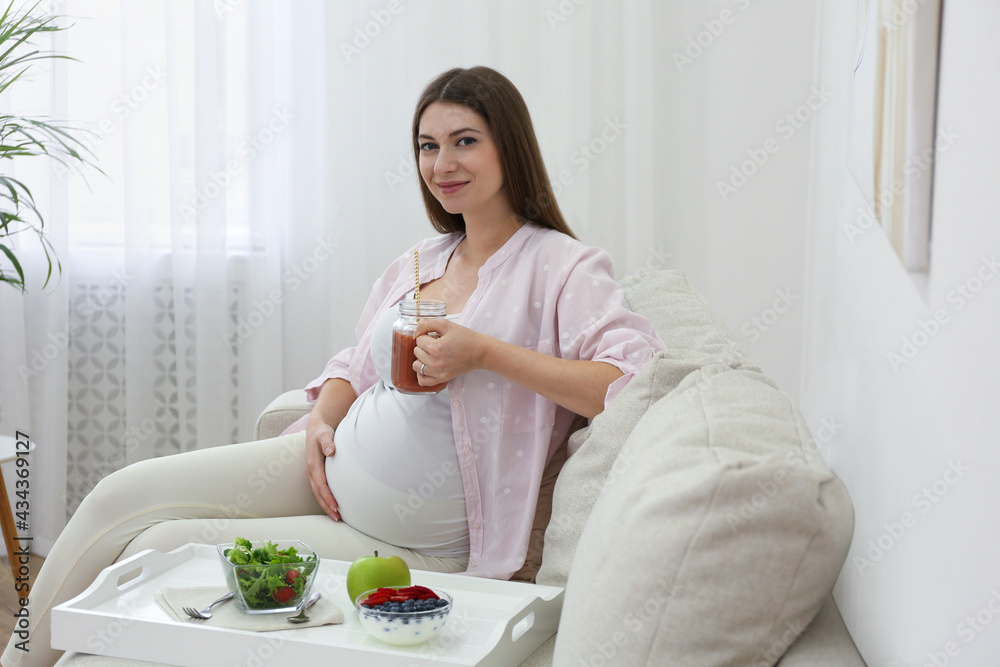 Pregnant woman eating breakfast at home. Healthy diet Pregnant woman eating breakfast at home. Healthy diet