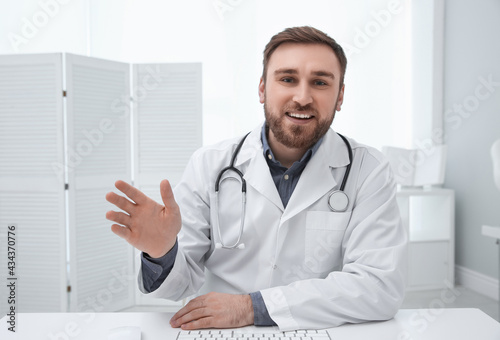 Pediatrician consulting patient using video chat in clinic, view from webcam