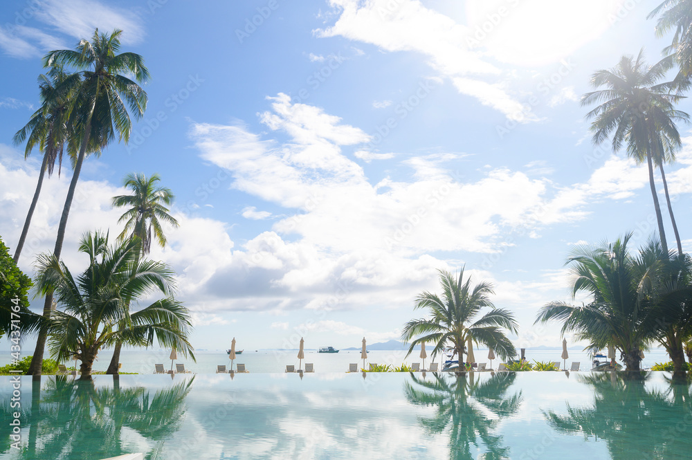 Fototapeta premium Beautiful view of swimming pool with Green tropical garden in cozy resort, phi phi island, Thailand