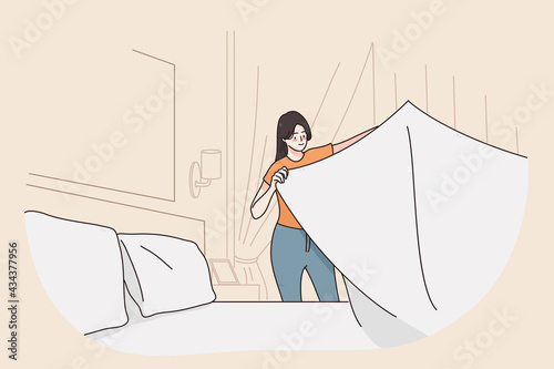 Laundry day and cleaning concept.Young smiling happy woman cartoon character standing holding clean white bedsheet in room vector illustration 