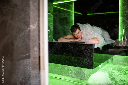 Man on the procedure of the foam massage in the hammam. Wellness and spa concept.
