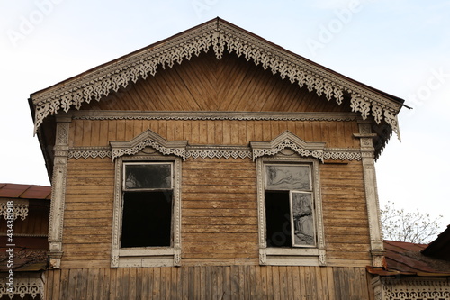 Broken windows of a vintage wooden house