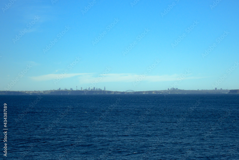 Sydney skyline in the distance from out at sea