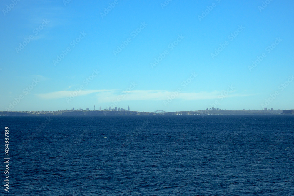 Fototapeta premium Sydney skyline in the distance from out at sea