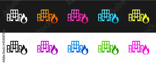Set Fire in burning buildings on city street icon isolated on black and white background. Destroyed city on fire. Vector
