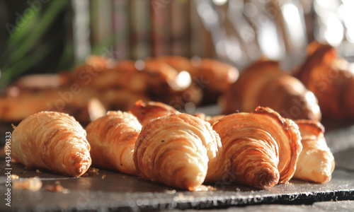 trays of mini croissants propped up in a display case