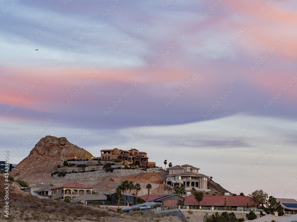 Fototapeta premium Beautiful afterglow, clouds and some residence building at Henderson