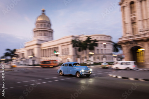 Old car on streets of Havana with Capitolio building in background. Cuba © danmir12