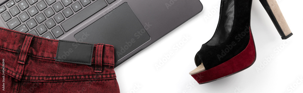 Laptop with shoe, skirt and accessories isolated on white backgroud Laptop with shoe, skirt and accessories isolated on white backgroud