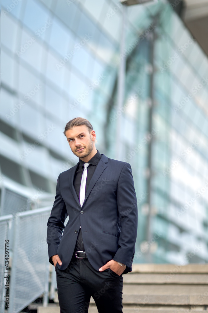 Handsome stylish young businessman posing outdoor portrait Handsome stylish young businessman posing outdoor portrait