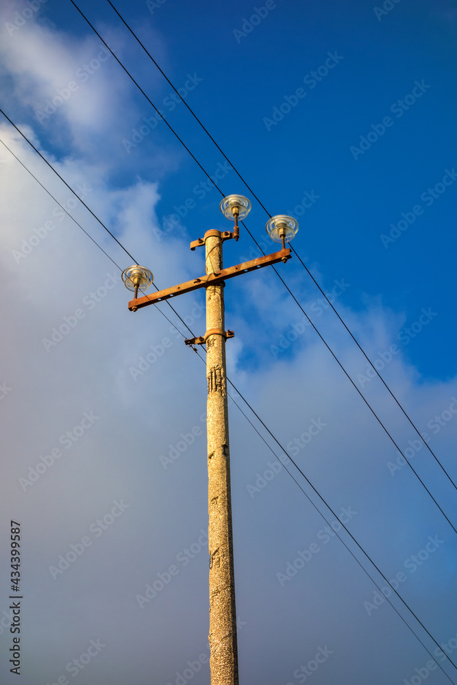 Old transmission tower with cloudy sky Old transmission tower with cloudy sky