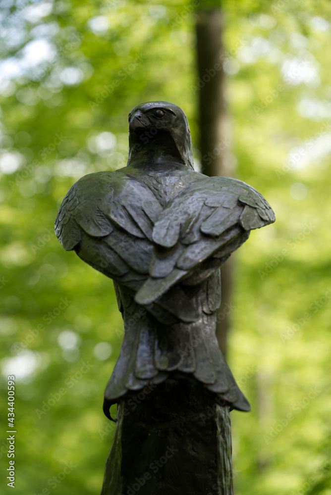 Iron eagle sculpture in the woods at City of Zurich. Photo taken May 18th, 2021, Zurich, Switzerland. Iron eagle sculpture in the woods at City of Zurich. Photo taken May 18th, 2021, Zurich, Switzerland.