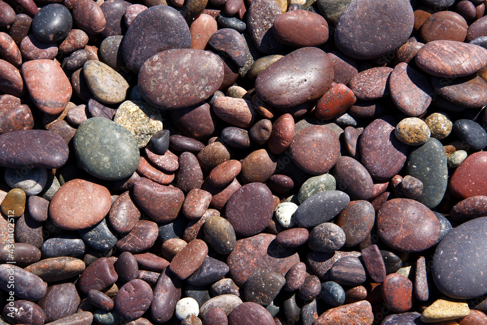 Red pebble stones on a beach Red pebble stones on a beach