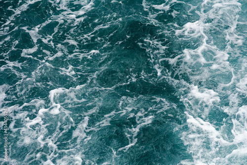 A close-up of the ocean wave surface wallpaper in the sunlight
