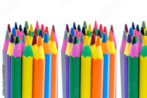 colored wooden pencils on white background