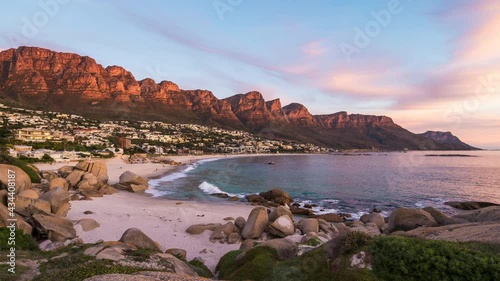 Time lapse view of sunset over Camps Bay Beach in Cape Town, Western Cape, South Africa. 