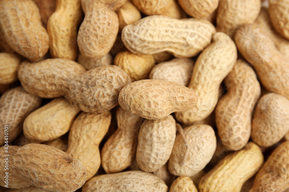 Heap of raw peanuts as background, top view Heap of raw peanuts as background, top view