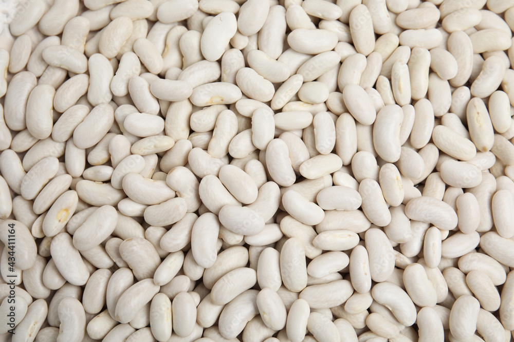 Heap of raw beans as background, top view. Veggie seeds