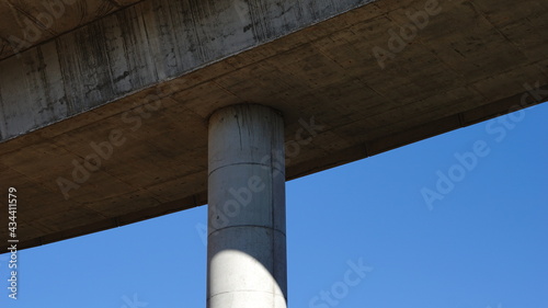 cement bridge column against sky