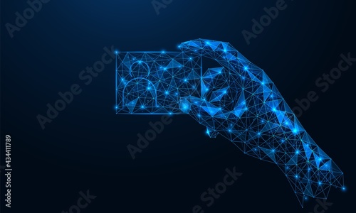 The hand holds a business card. Polygonal construction of lines and points. Blue background.