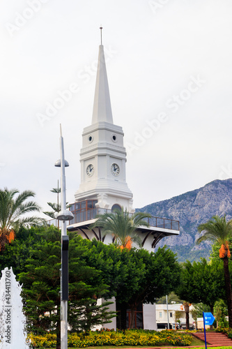 White clock tower in the center of Kemer, Antalya province, Turkey