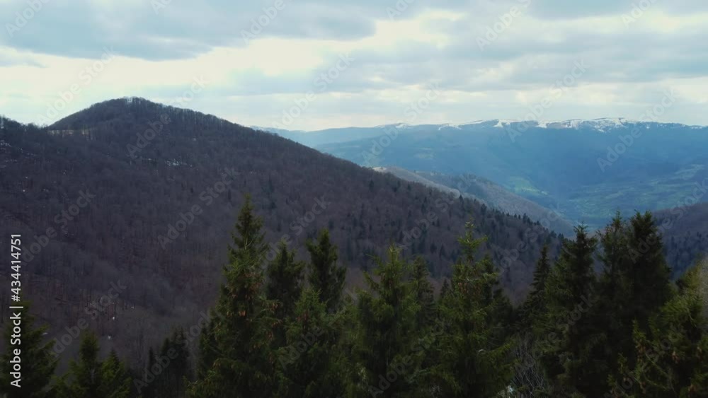 Stunning view to mountain covered with pine trees. Flying drone. Europe Carpathians. Concept of flight, nature, breathtaking beauty of our planet. Stunning view to mountain covered with pine trees. Flying drone. Europe Carpathians. Concept of flight, nature, breathtaking beauty of our planet.