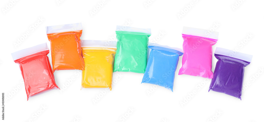 Many packages of different colorful plasticine on white background, top view