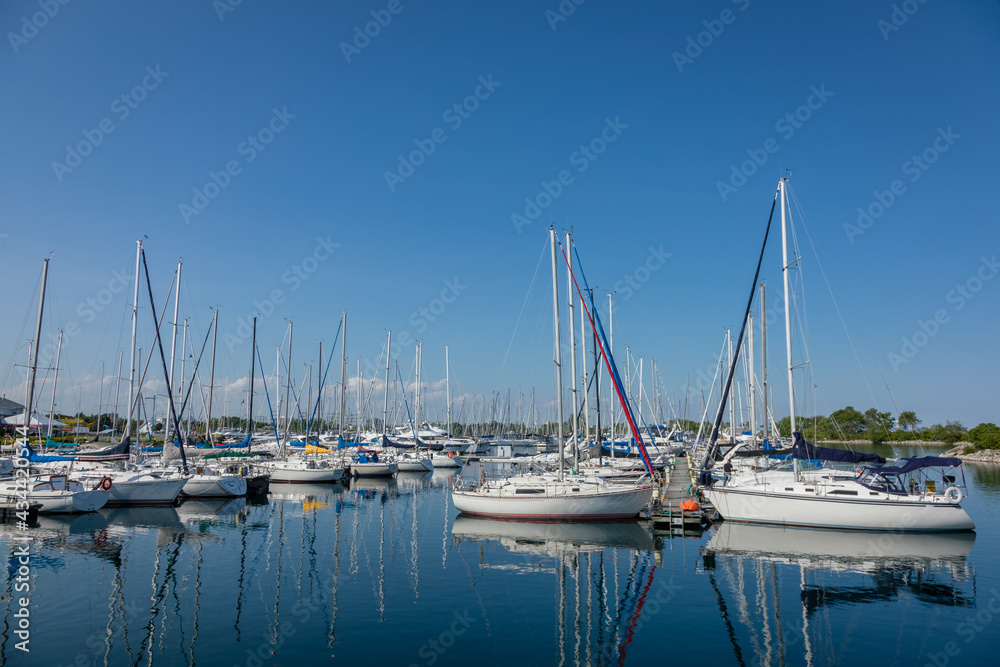 Boat and sailboats mored at waterfront park, Toronto, Ontario