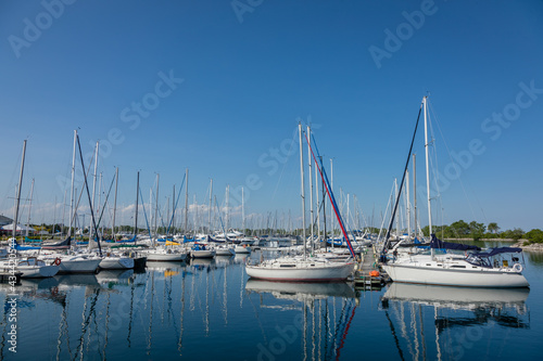 Boat and sailboats mored at waterfront park  Toronto  Ontario