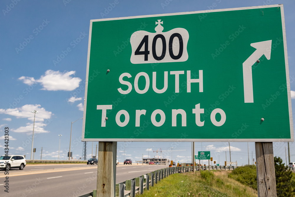 Highway 400 south signs to Toronto. Highway 400 south signs to Toronto.