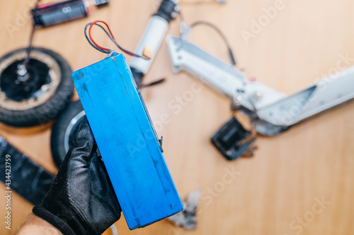 Electric scooter repair, electric vehicle battery replacement.