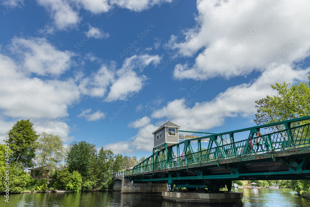 A view of the Huntsville Swing Bridge from the Town dock park on the Muskoka River. A view of the Huntsville Swing Bridge from the Town dock park on the Muskoka River.
