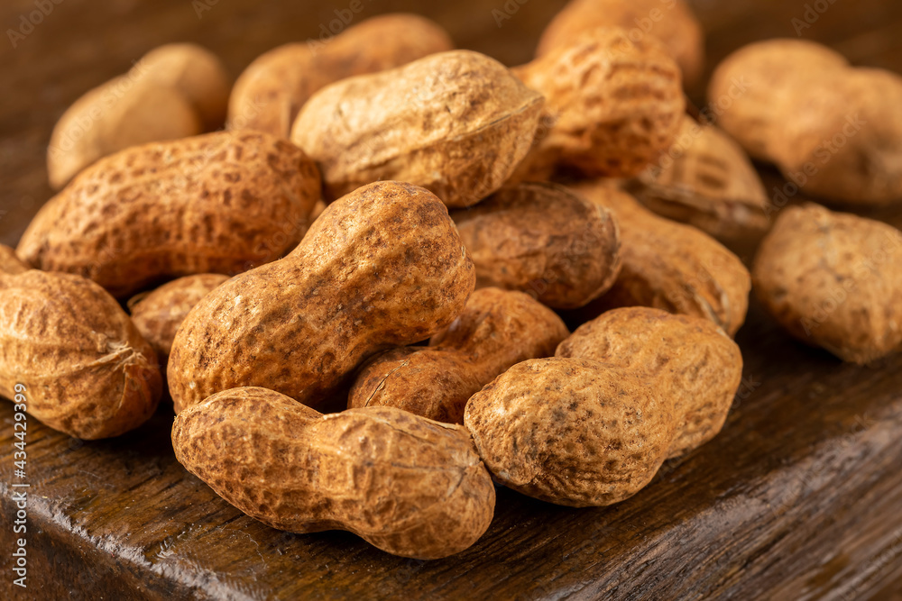 Dry peanut on the wooden background. Dry peanut on the wooden background.