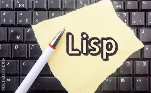 Lisp Programming Language. Word Lisp on paper and laptop
 photo