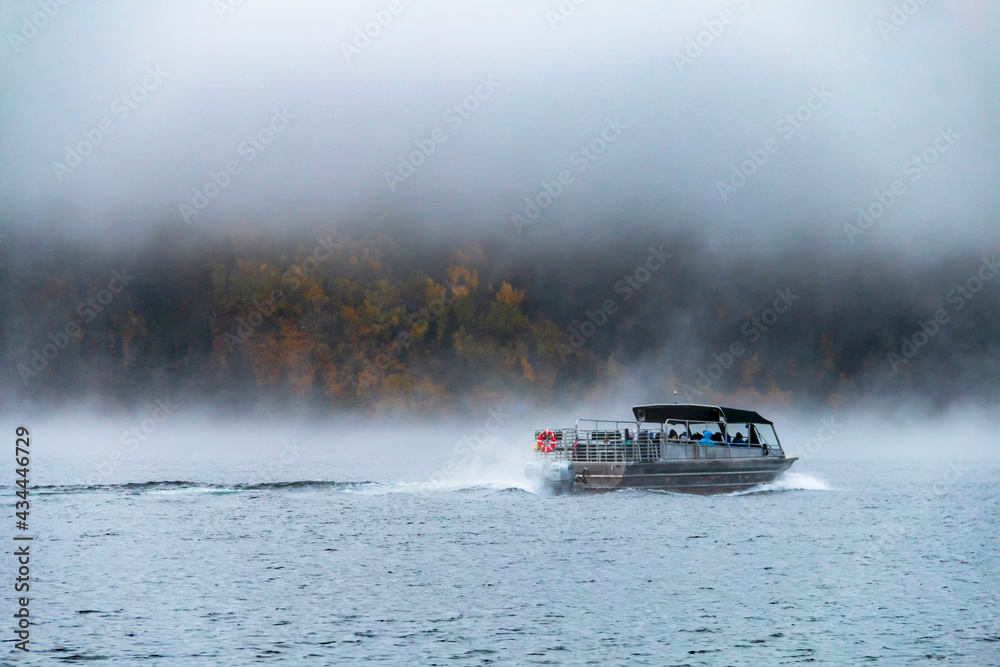 Fototapeta premium foggy and cloudy autumn morning in Jenny Lake in Grand Teton National Park in Wyoming.