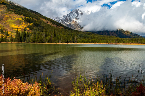 foggy and cloudy autumn morning in Jenny Lake in Grand Teton National Park in Wyoming.