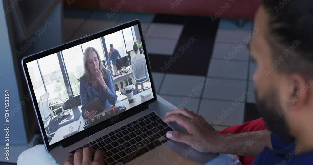 African american man having a video call with female office colleague on laptop at home African american man having a video call with female office colleague on laptop at home